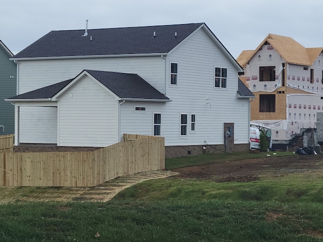 rear view of house with a lawn