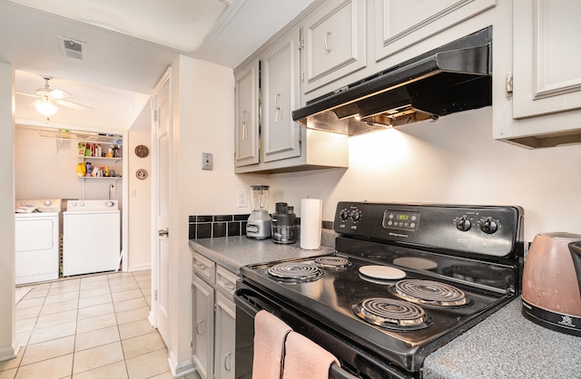 kitchen featuring ceiling fan, separate washer and dryer, light tile patterned floors, and black electric range