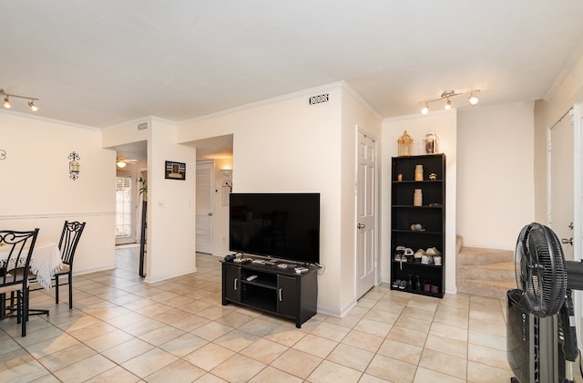 living room featuring ornamental molding, rail lighting, and light tile patterned flooring