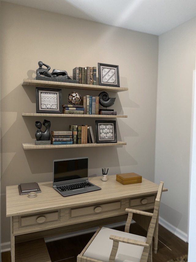 office space with dark wood-type flooring