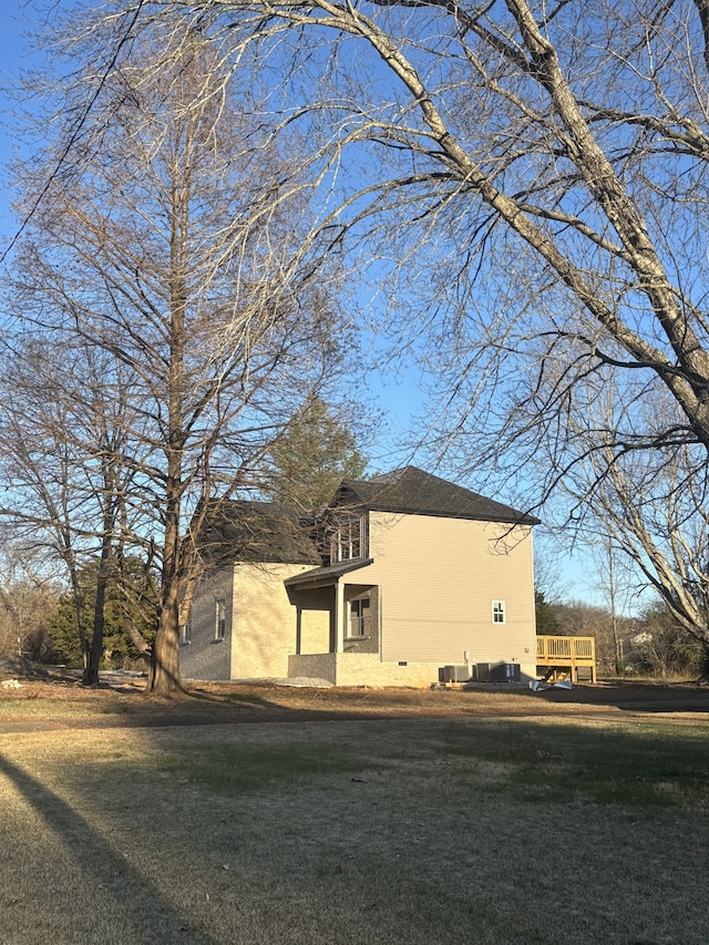 view of home's exterior with a lawn