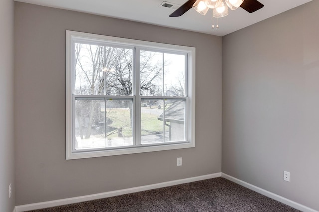 carpeted empty room featuring ceiling fan