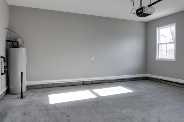 garage featuring electric water heater and a garage door opener