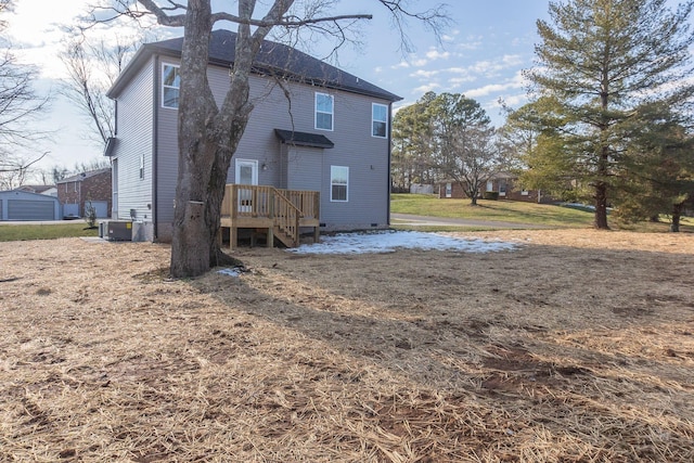 rear view of house with cooling unit