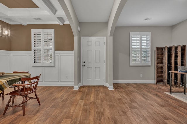 foyer entrance featuring hardwood / wood-style flooring, beam ceiling, and coffered ceiling