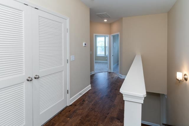 hallway featuring dark hardwood / wood-style floors