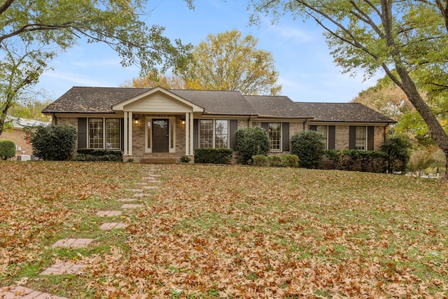 ranch-style house with a front lawn