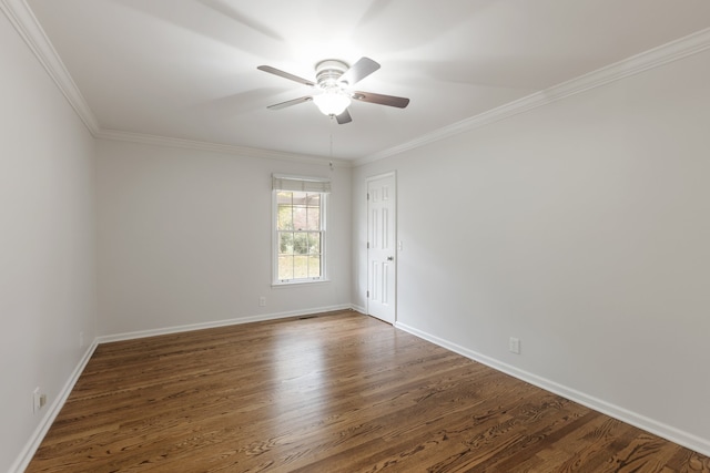 unfurnished room featuring dark hardwood / wood-style flooring, ceiling fan, and crown molding