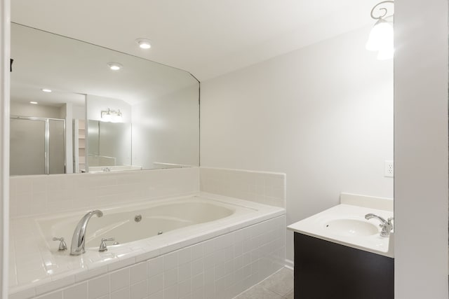 bathroom with independent shower and bath, vanity, and tile patterned floors