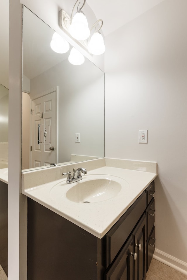 bathroom featuring tile patterned flooring and vanity