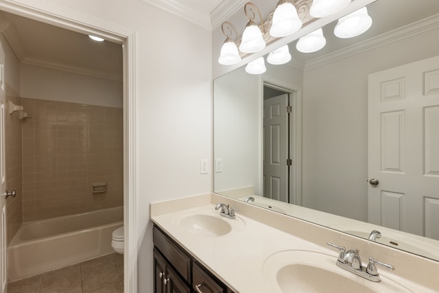 full bathroom featuring tile patterned flooring, tiled shower / bath, ornamental molding, vanity, and toilet