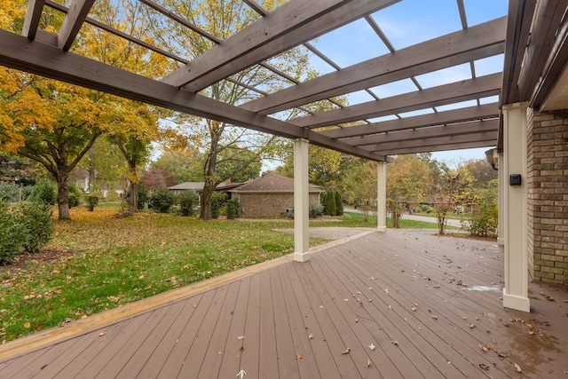 wooden deck with a pergola and a lawn