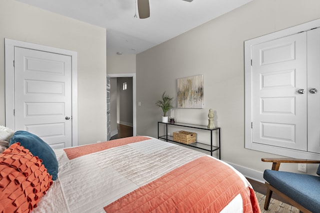 bedroom with hardwood / wood-style floors and ceiling fan