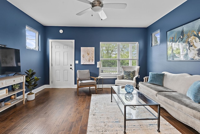 living room with dark hardwood / wood-style floors and ceiling fan