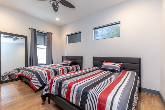 bedroom featuring wood-type flooring and ceiling fan