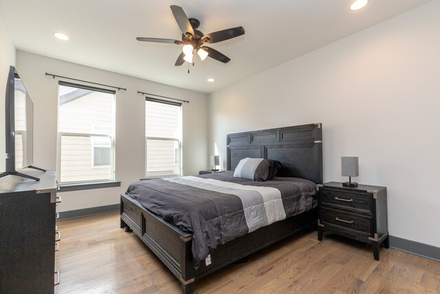 bedroom featuring hardwood / wood-style flooring and ceiling fan