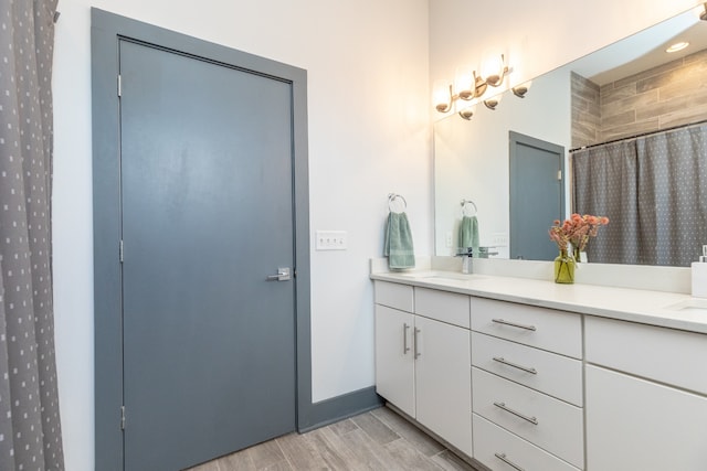 bathroom featuring a shower with curtain, vanity, and hardwood / wood-style flooring