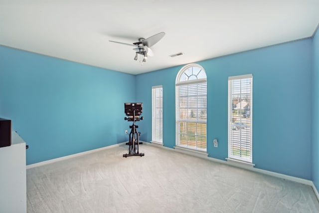 interior space featuring ceiling fan