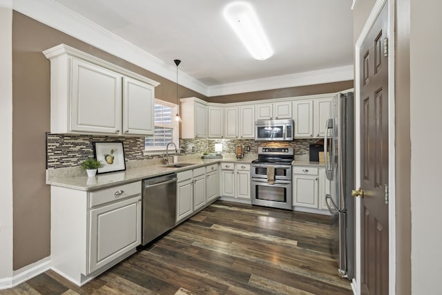 kitchen with dark hardwood / wood-style flooring, white cabinets, and appliances with stainless steel finishes