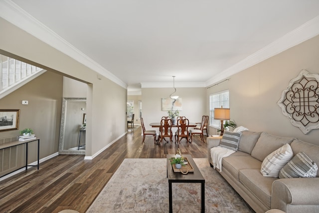 living room with dark hardwood / wood-style flooring and crown molding