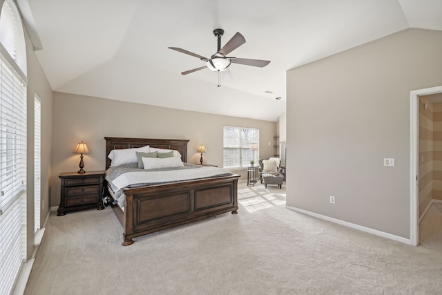 carpeted bedroom featuring vaulted ceiling and ceiling fan