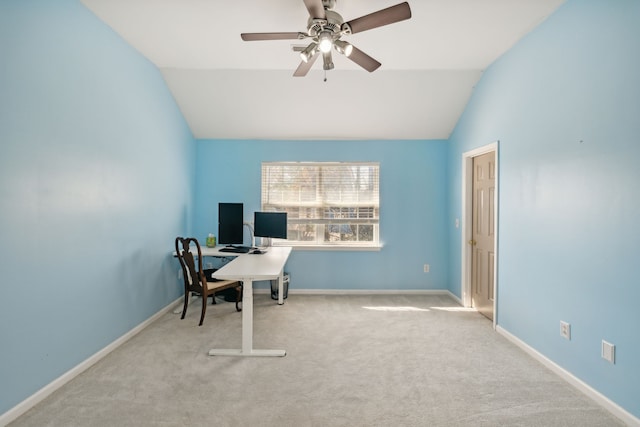 carpeted office space with ceiling fan and lofted ceiling