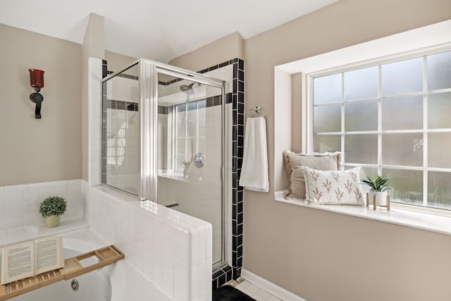 bathroom featuring tile patterned flooring and plus walk in shower