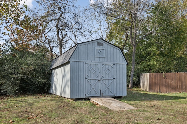 view of outdoor structure featuring a lawn