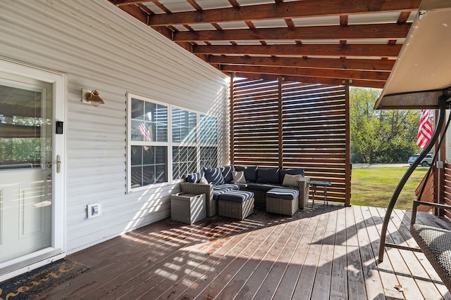 wooden terrace with an outdoor living space