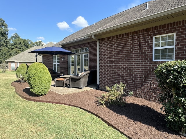 back of house with a lawn