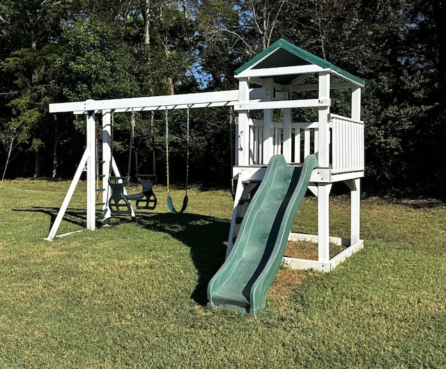 view of playground with a lawn