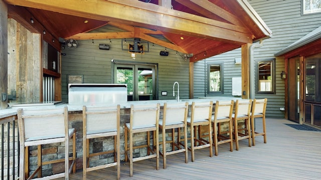 wooden terrace with a wet bar