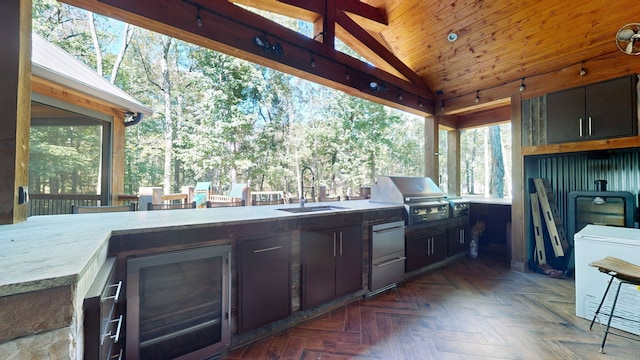 view of patio / terrace with an outdoor kitchen, grilling area, sink, and beverage cooler