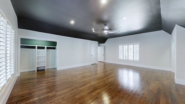 unfurnished bedroom featuring dark hardwood / wood-style flooring, a closet, and ceiling fan