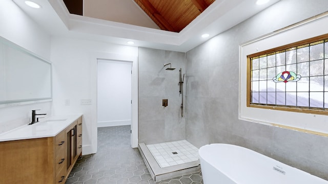 bathroom featuring tile patterned flooring, shower with separate bathtub, vaulted ceiling with beams, and vanity