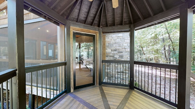 unfurnished sunroom with lofted ceiling