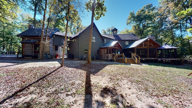 view of front of house featuring central AC and a gazebo