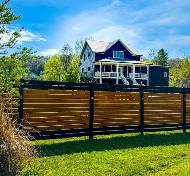 view of gate with a yard