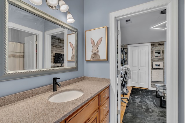 bathroom with vanity and hardwood / wood-style flooring