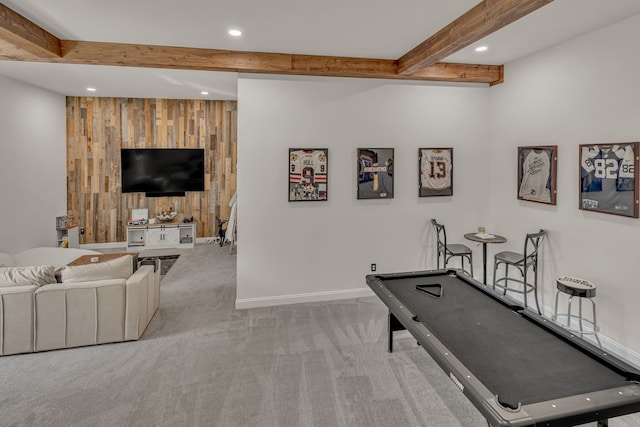 workout room featuring wooden walls and light carpet