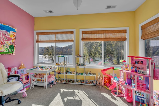 recreation room featuring carpet floors and ceiling fan