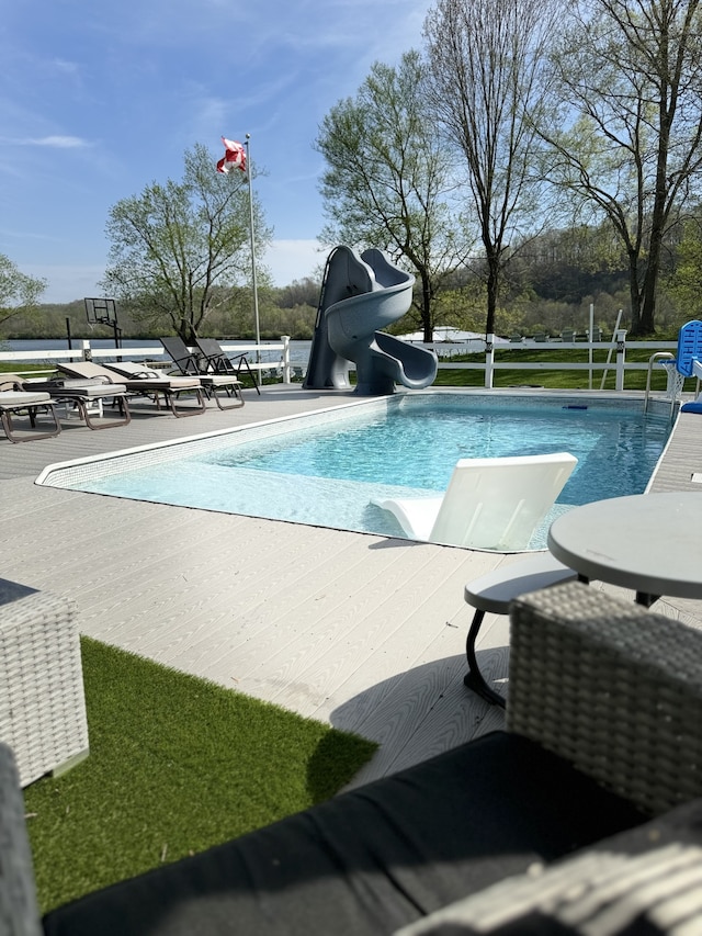 view of pool featuring a water slide