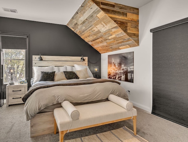 bedroom with lofted ceiling and carpet