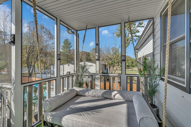 unfurnished sunroom featuring a healthy amount of sunlight