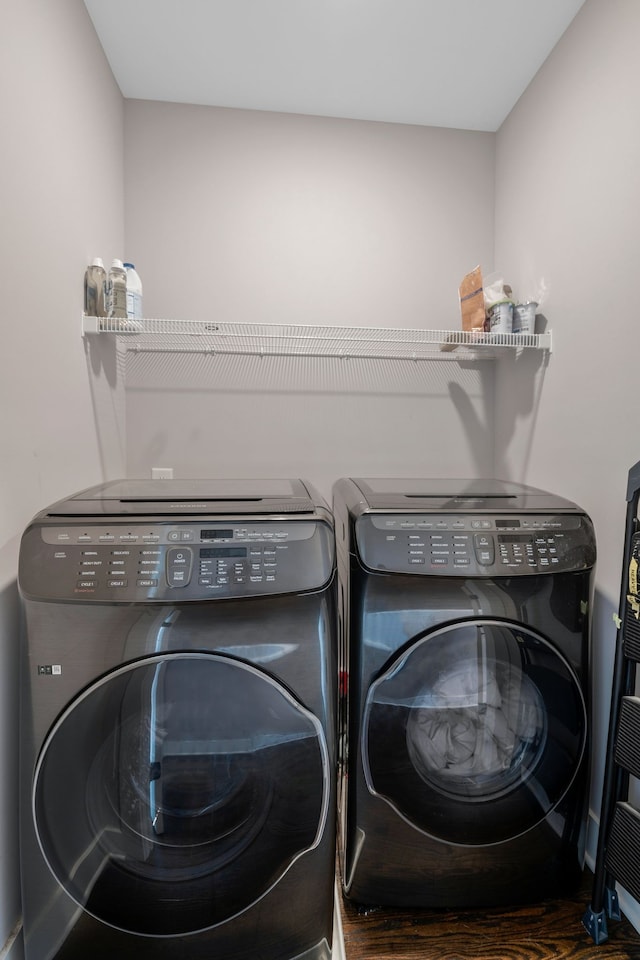 laundry room with washing machine and clothes dryer