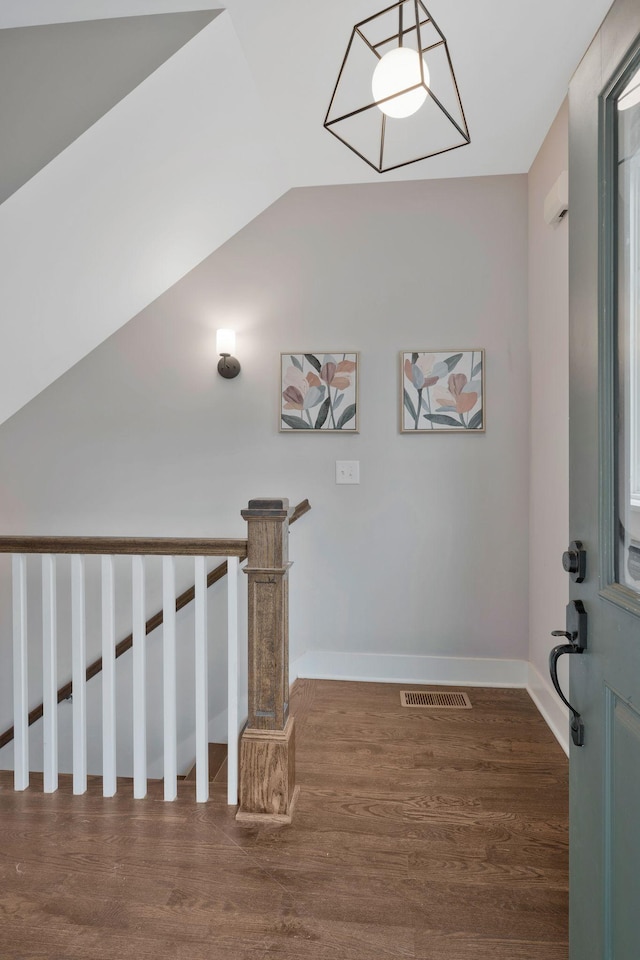 stairs featuring wood-type flooring