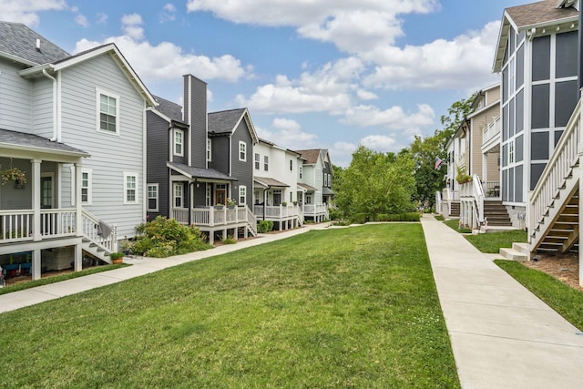 view of home's community featuring a lawn