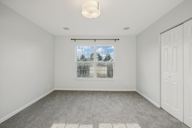 unfurnished bedroom featuring a closet and carpet