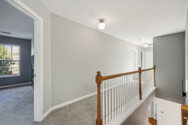 hallway with light carpet