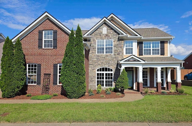 view of front of property featuring a porch and a front yard